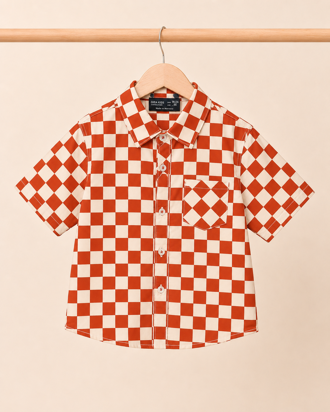 Boys rust cream checkerboard shirt - front view on hanger